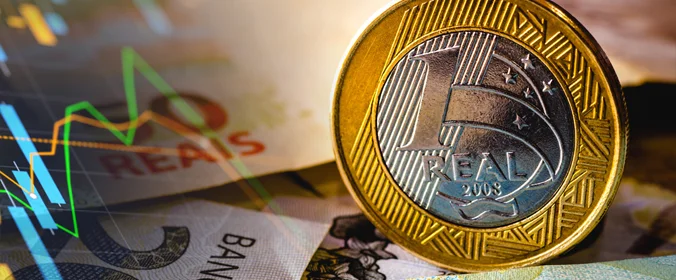 foto de cédulas de 100 reais e moedas de 1 real 