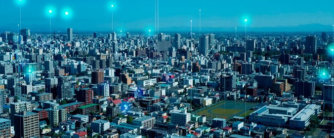 foto aérea de uma cidade com alguns hologramas desenhados em cima